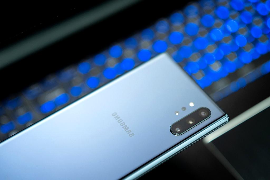 Open notebook with digital notes on screen